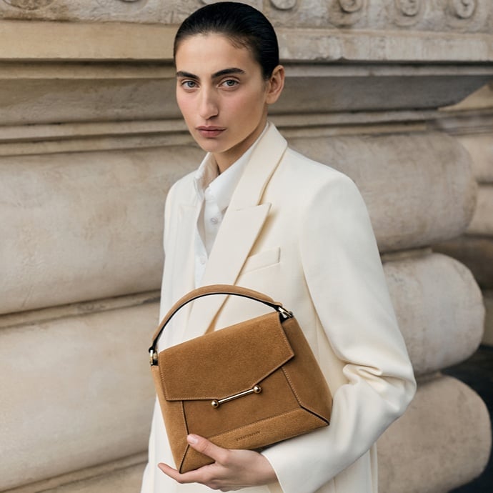 Image of a model with Strathberry bag